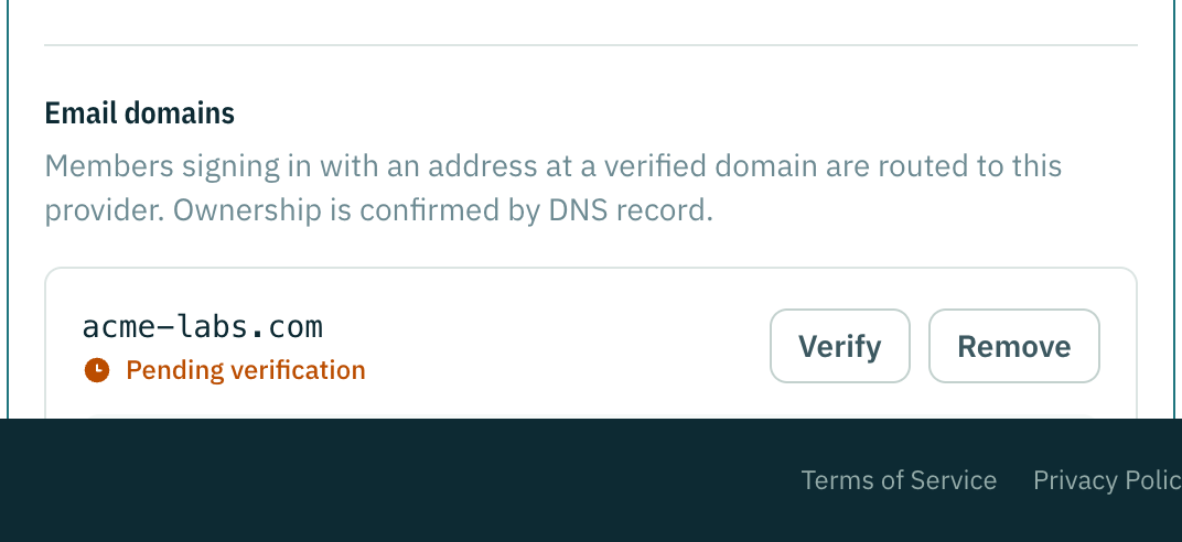 The email domains panel: one domain verified, one showing the TXT record it is waiting for.